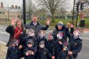 left Simone Mitchell, Headteacher of Beachborough School, Steven Broadbent, Buckinghamshire Council's Cabinet Member for Transport and Cathy Knott, Clerk from Westbury Parish Council join the children in their puffin masks at the new crossing.