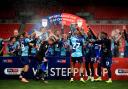 Wycombe celebrate being promoted to the Championship