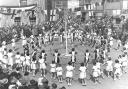 These girls are dancing round the Maypole in the Market Place, Princes Risborough, 1935