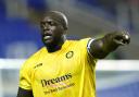 Adebayo Akinfenwa (pictured against Reading in 2020) scored Wycombe's goal late against AFC Wimbledon (PA)
