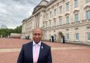 Mark Rosales pictured outside Buckingham Palace.