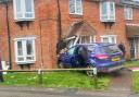 Car crashed into house
