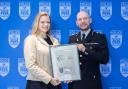 Marie Gumpert with her commendation from Chief Constable Jason Hogg