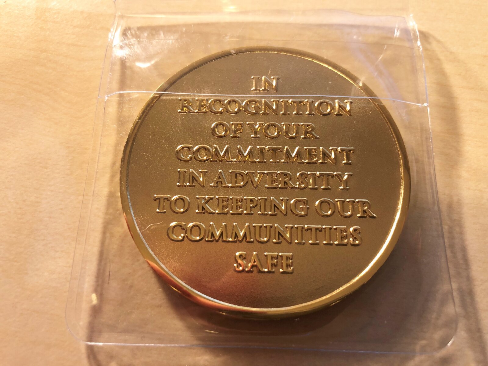 Commemorative coins were sent to Thames Valley Police staff and volunteers. Images via online forum user.