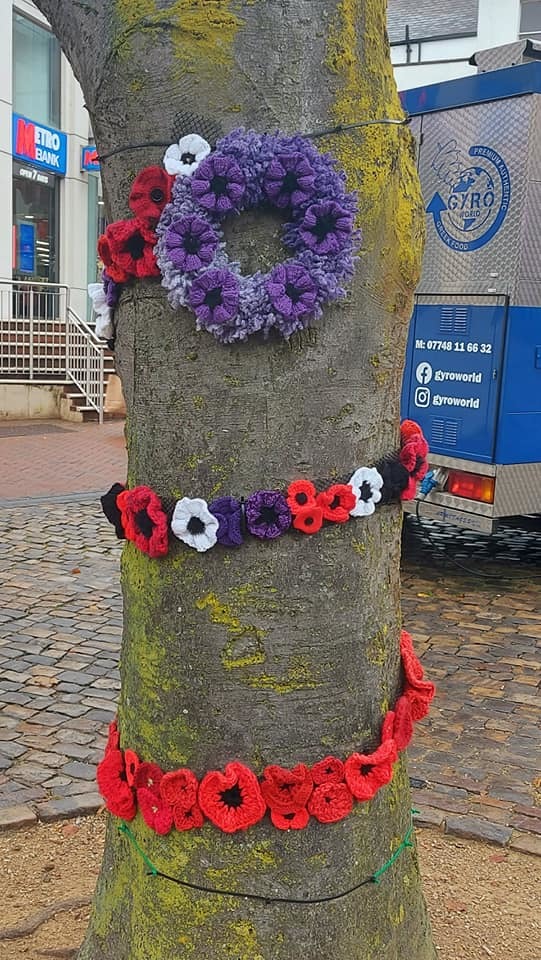 A tree in Aylesburys Market Square is covered in homemade poppies (Karen Livett)