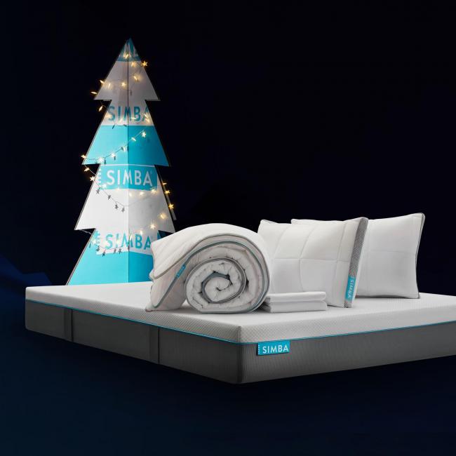 Simba Sleep products included in the Boxing Day sale in front of a blue and white Christmas tree. Credit: Simba Sleep