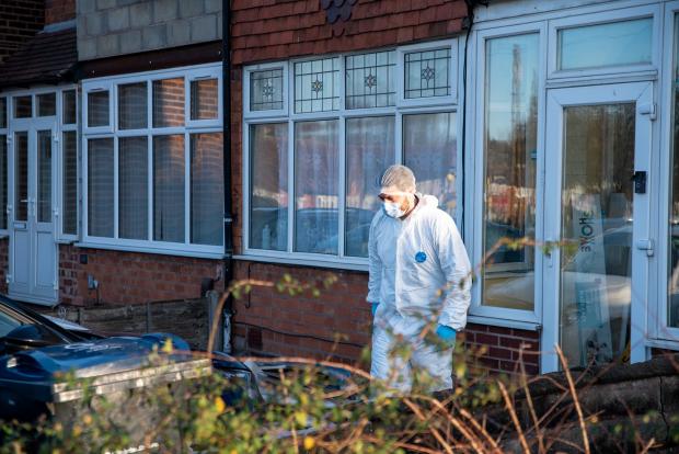 Bucks Free Press: A police forensic team investigates a property in Great Barr, Birmingham, where two suspects were arrested