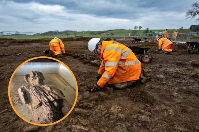 (Background) Archaeologists excavating the site (HS2/PA) (Circle) Roman wooden carved figure which has been discovered in a waterlogged ditch during work on the HS2 project (HS2/PA)