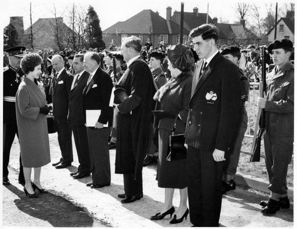 Queen Elizabeth II is presented to education officers, the Head-master and Head-boy at the Royal Grammar School, Amersham Road High Wycombe. April 1962