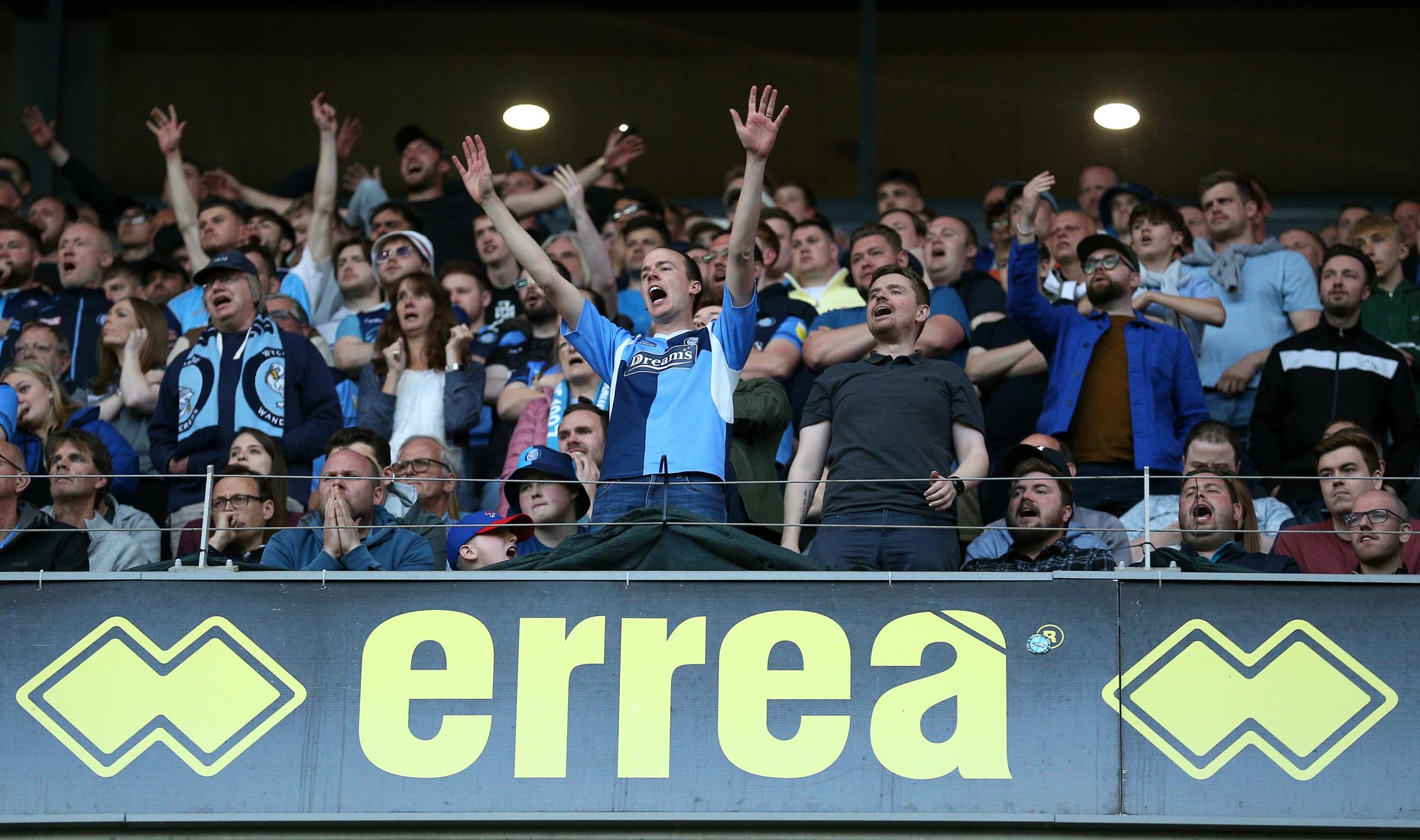 The Wycombe fans celebrating at Stadium: MK when the full-time whistle went (PA)