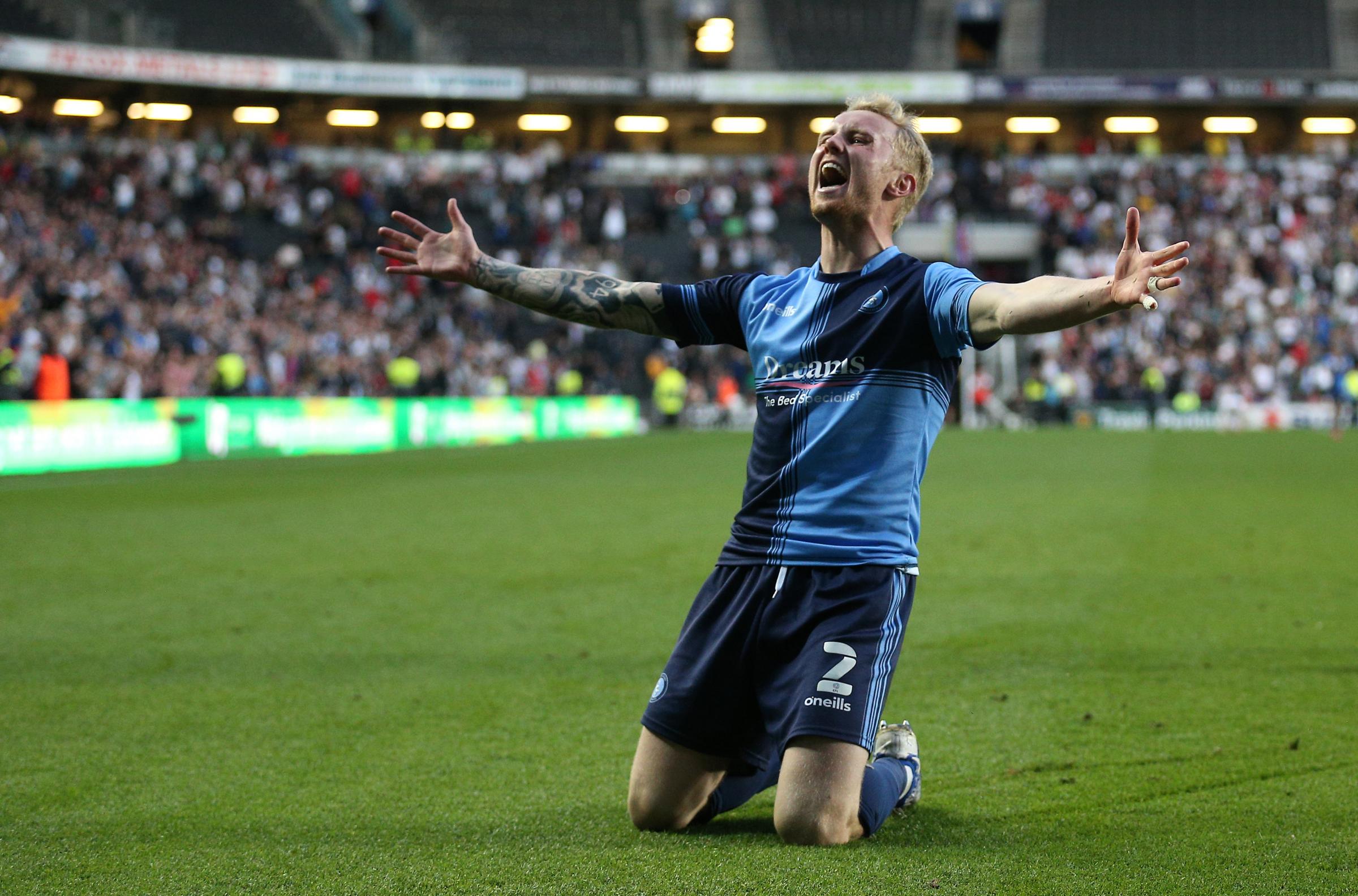 Jack Grimmer, who came on in the second half celebrates in front of the Wanderers faithful (PA)