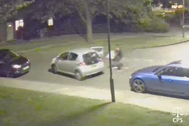 CCTV that the prosecution say shows the robber getting into a getaway car Picture: CPS