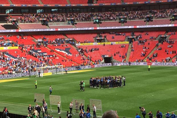 The Wycombe players formed a huddle after their League One play-off final defeat against Sunderland