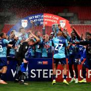 Wycombe celebrate being promoted to the Championship
