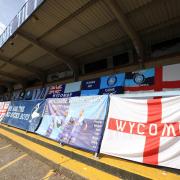 Some of the Wycombe flags that were put up at Adams Park during the Covid season of 2020/21 (PA)