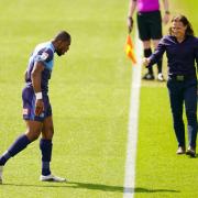 Wycombe Wanderers' Uche Ikpeazu celebrates his goal with manager Gareth Ainsworth and AFC Bournemouth's during the Sky Bet Championship match at Adams Park, Wycombe on Saturday, May 1 (PA)