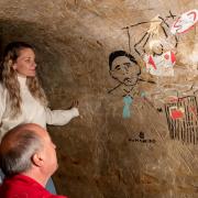 Artist Emmy Smith creates modern cave paintings with the help of cave expert Paul Pettit at Hellfire Caves