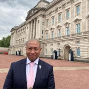 Mark Rosales pictured outside Buckingham Palace.