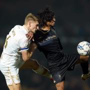 Port Vale's Nathan Smith (left) and Salford City's D'Mani Bughail-Mellor battle for the ball during the Sky Bet League Two match at Vale Park in January 2022 (PA)