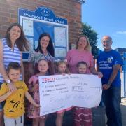 The Prestwood Infant School youngsters received the precious cheque.