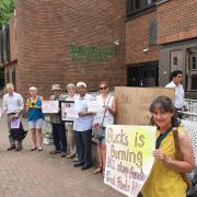 The campaigners called for Bucks Council to stop funding fossil fuels.