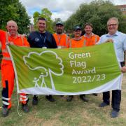 Councillor Clive Harriss, Buckinghamshire Council’s Cabinet Member for Culture and Leisure, celebrates at Vale Park with members of the council’s parks team