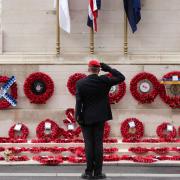 A member of the armed services gives a salute at the Cenotaph on Whitehall in London as the nation fell silent to remember the war dead on Armistice Day (Yui Mok/PA)