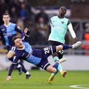Wycombe's Josh Scowen (pictured in December against Portsmouth) missed the 2-0 win over Fleetwood Town