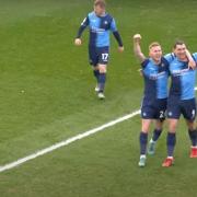 Jason McCarthy and Sam Vokes celebrate after the latter scored via his buttocks against Crewe Alexandra in March 2022