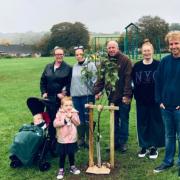 'A piece of him will be here forever': Family plant tree in memory of local 'hero'