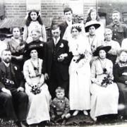 A family wedding, with Ellen sitting on the far right of the front row and her husband Mark Blackall on the far left, c.1915.