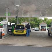 A man filling up fuel in Asda, High Wycombe