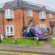 Car crashed into house