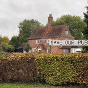 Save our pub sign outside