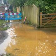 Sinkhole flooding causes traffic chaos in Bucks village