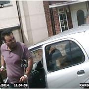 Picture shows Amar Masud, 44, captured in video surveilance footage. Image from evidence shown to High Court.