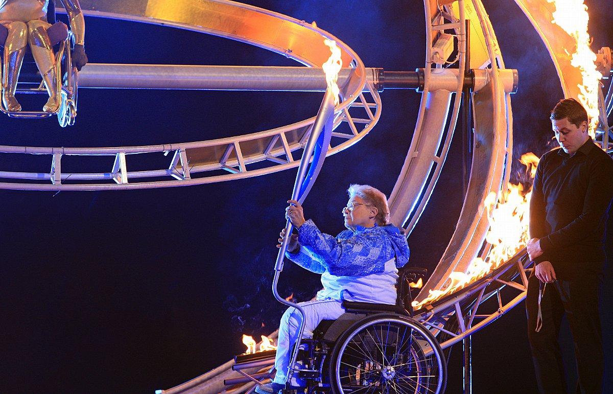 Caz Walton lights the Sochi 2014 Winter Paralympic Torch.
