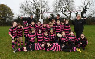 The Under 9s team pose with their new kits