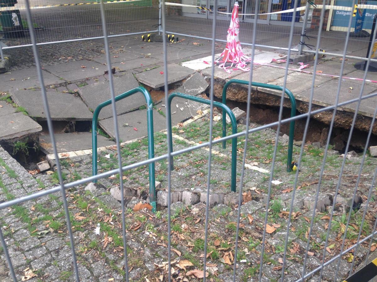 Pictures And Video Fears As Huge Sinkhole Outside Shops In